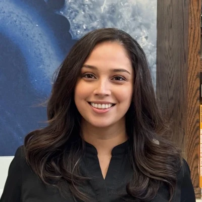 Chiropractic Plano TX Jessica Meet The Team Jessica smiling in a black shirt.